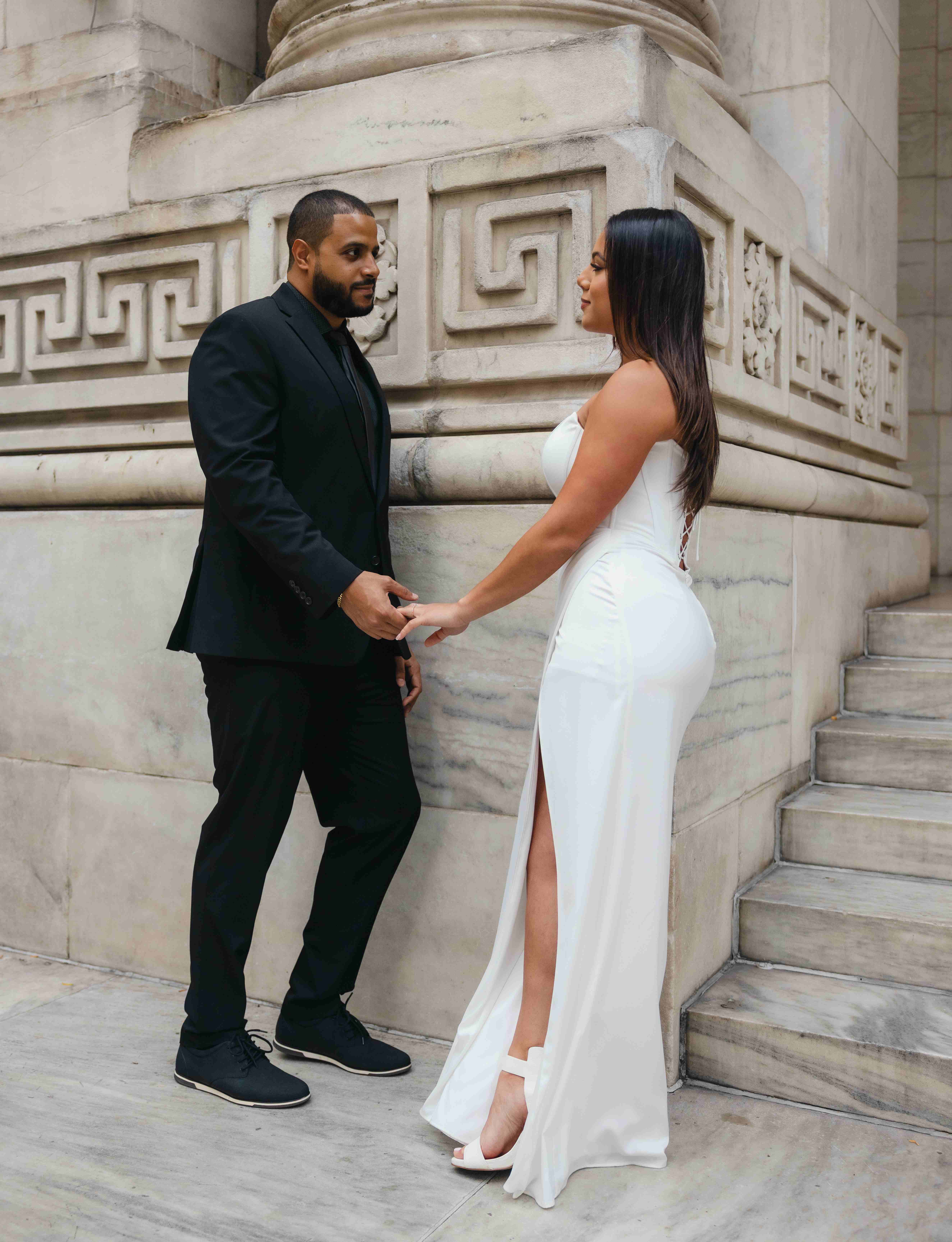 Janna and Rafael intimate embrace on building steps